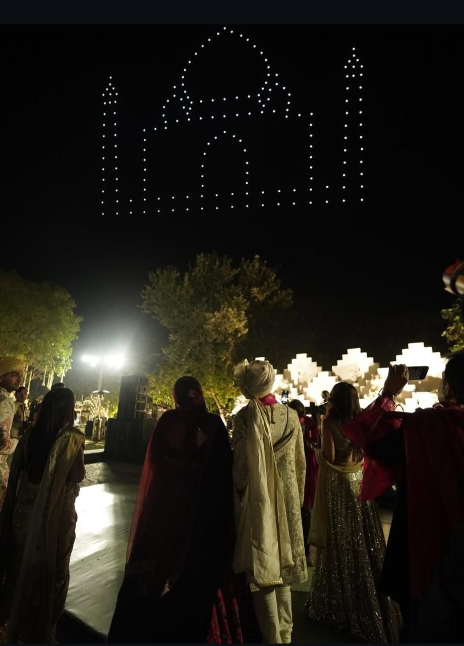 SkyLit Drone Show – Taj Mahal formation at Indian wedding, guests watching